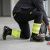 Spodnie robocze elastyczne Actiflex Neo — czarne z żółtymi wstawkami hi-vis, stretch 250 g/m², taśmy 5 cm