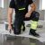 Ogrodniczki robocze elastyczne Actiflex Neo — czarno-żółte hi-vis, stretch 250 g/m², taśmy 5 cm