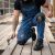 Ogrodniczki robocze jeansowe Rodeo Jeans — niebieskie, denim stretch 340 g/m², kieszenie na nakolanniki