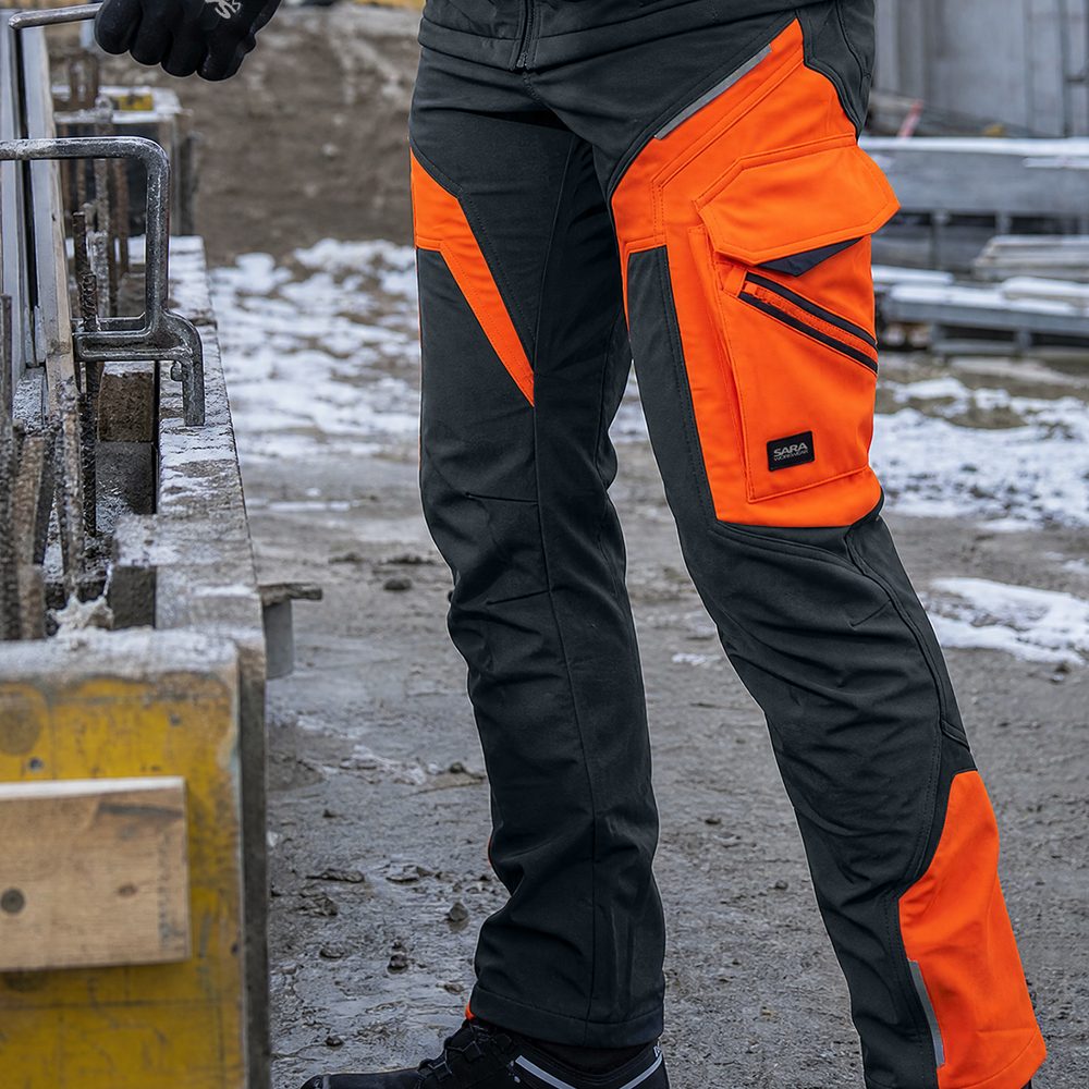 Spodnie robocze softshell Comfort Winter — grafitowo-pomarańczowe, wiatroszczelne, wodoodporne 350 g/m², zamki