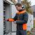Kurtka robocza hybrydowa Comfort Winter grafitowo-pomarańczowa — softshell z pikowaniem 350 g/m², wiatroszczelna, wodoodporna, odpinany kaptur